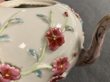 A pair of Chinese famille rose relief-decorated teapots with floral design, Yongzheng